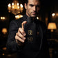 Man holding Black Spice Eau de Parfum bottle